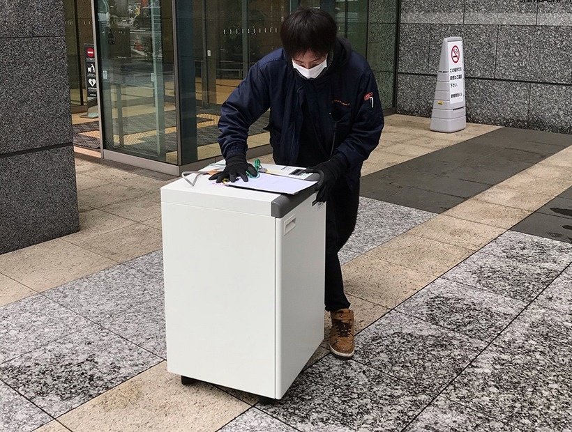 神奈川県横浜市のインテリジェントビル内に構えた大規模オフィスから印刷機を回収
